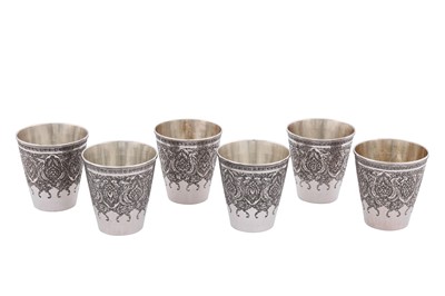 Lot 98 - A set of six mid-20th century Iranian (Persian) silver beakers, Isfahan circa 1950 mark of Hussain Parvaresh