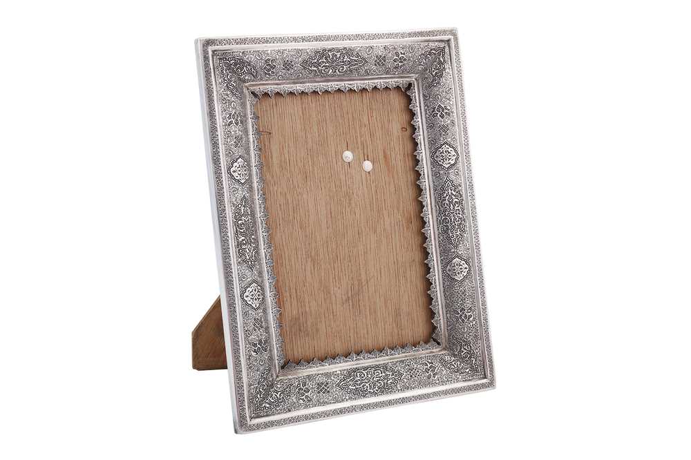 Lot 85 - A mid to late 20th century Iranian (Persian) silver photograph or mirror frame, Isfahan circa 1970, workshop mark obscured
