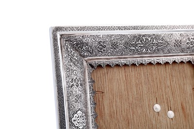 Lot 85 - A mid to late 20th century Iranian (Persian) silver photograph or mirror frame, Isfahan circa 1970, workshop mark obscured