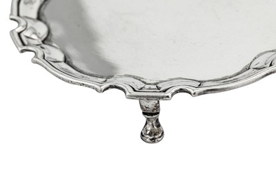 Lot 293 - A George II sterling silver tea or coffee pot stand, London 1732 by John Swift (reg. between May-Oct 1728)