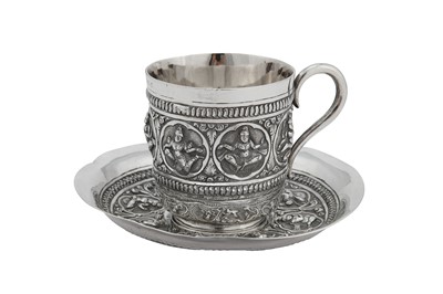Lot 128 - A late 19th / early 20th century Anglo – Indian Raj unmarked silver cup and saucer, Madras circa 1900