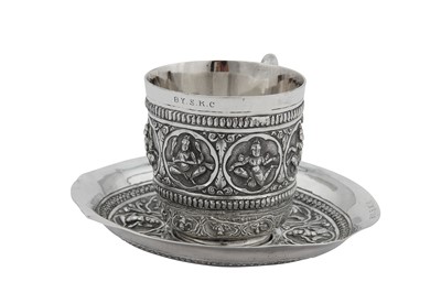 Lot 128 - A late 19th / early 20th century Anglo – Indian Raj unmarked silver cup and saucer, Madras circa 1900