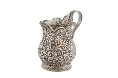 Lot 121 - A late 19th century Anglo – Indian Raj unmarked silver cream jug, Cutch circa 1880-1900
