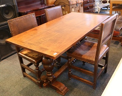 Lot 528 - A small oak refectory table, with four leather...