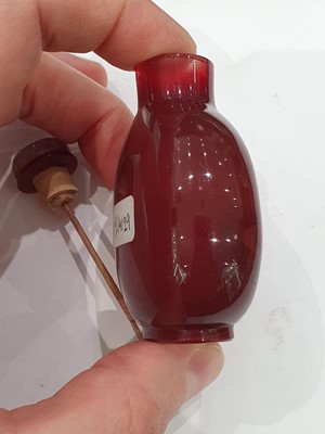 Lot 440 - A CHINESE RED BEIJING GLASS SNUFF BOTTLE