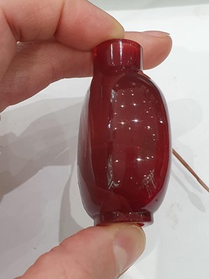 Lot 440 - A CHINESE RED BEIJING GLASS SNUFF BOTTLE