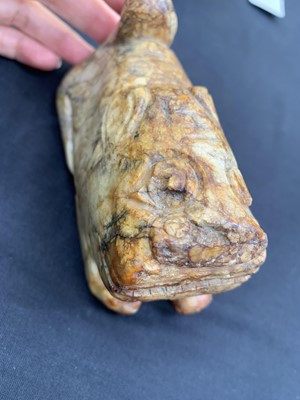 Lot 4 - A CHINESE RUSSET JADE CARVING OF A TIGER.