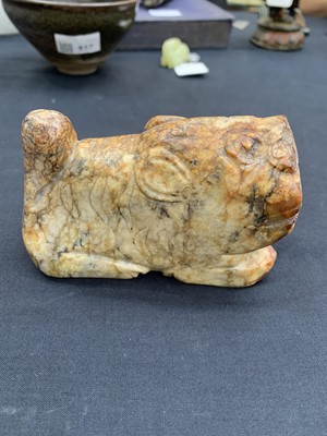Lot 4 - A CHINESE RUSSET JADE CARVING OF A TIGER.