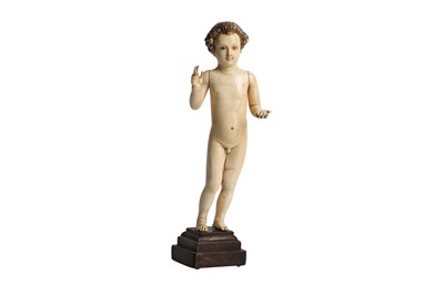 Lot 193 - λ A CARVED IVORY FIGURE OF CHRIST AS A BABY BOY