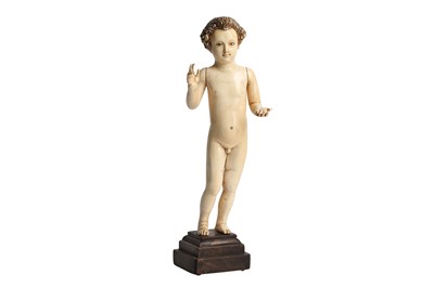 Lot 897 - λ A CARVED IVORY FIGURE OF CHRIST AS A BABY BOY