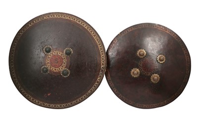 Lot 400 - TWO INDIAN POLYCHROME-PAINTED AND LACQUERED LEATHER SHIELDS (DHAL)