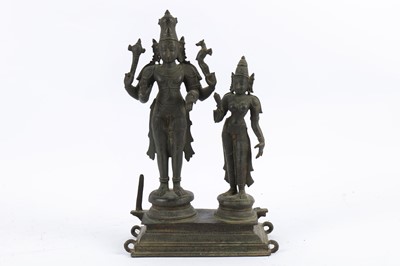Lot 201 - A CHOLA-REVIVAL BRONZE PROCESSIONAL STATUE OF SHIVA AND PARVATI