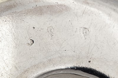 Lot 455 - A George II silver 'duty dodger' chamber stick, London circa 1730 by George Boothby (reg. 4th Aug 1720)