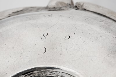 Lot 455 - A George II silver 'duty dodger' chamber stick, London circa 1730 by George Boothby (reg. 4th Aug 1720)