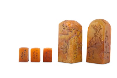 Lot 598 - A PAIR AND A SET OF THREE CHINESE SQUARE-SECTION ORANGE STONE SEALS.