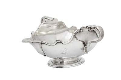 Lot 464 - A George I French plate silvered brass double lipped sauceboat, London circa 1725