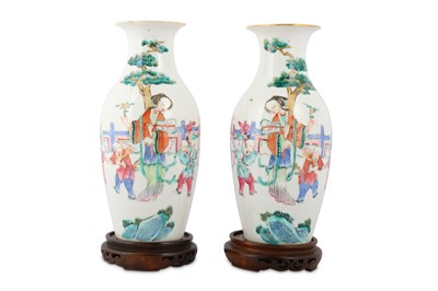 Lot 18 - A PAIR OF CHINESE FAMILLE ROSE 'LADY AND BOYS' VASES.