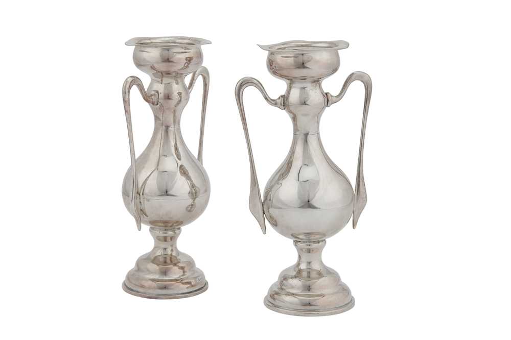 Lot 331 - A pair of Edwardian sterling silver vases, Sheffield 1903 by Walker and Hall
