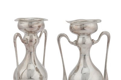 Lot 331 - A pair of Edwardian sterling silver vases, Sheffield 1903 by Walker and Hall