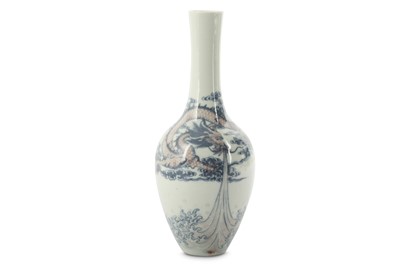 Lot 487 - A CHINESE BLUE AND WHITE AND COPPER RED 'DRAGON' BOTTLE VASE.