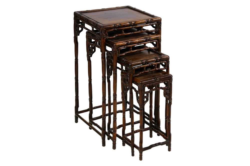 Lot 157 - A NEST OF FOUR CHINESE HARDWOOD 'BAMBOO' TABLES.