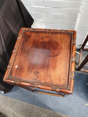 Lot 157 - A NEST OF FOUR CHINESE HARDWOOD 'BAMBOO' TABLES.