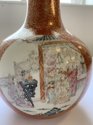 Lot 13 - A CHINESE FAMILLE ROSE CORAL-GROUND BOTTLE VASE.