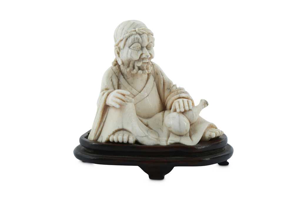 Lot 601 - λ A CHINESE IVORY FIGURE OF LIBAI.