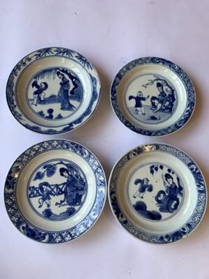 Lot 79 - FOUR CHINESE BLUE AND WHITE 'LADY AND BOY' SAUCERS.