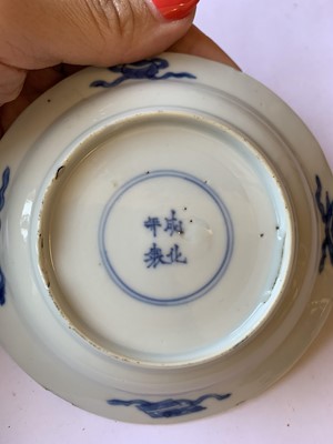 Lot 432 - FOUR CHINESE BLUE AND WHITE 'LADY AND BOY' SAUCERS.