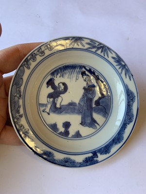 Lot 79 - FOUR CHINESE BLUE AND WHITE 'LADY AND BOY' SAUCERS.