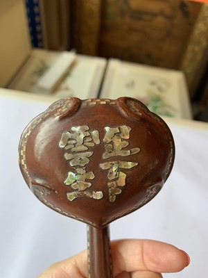 Lot 550 - A CHINESE MOTHER OF PEARL-INSET LACQUER WOOD RUYI SCEPTRE.