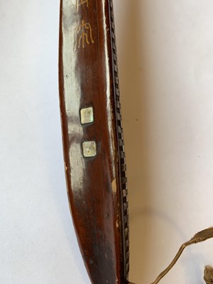 Lot 550 - A CHINESE MOTHER OF PEARL-INSET LACQUER WOOD RUYI SCEPTRE.