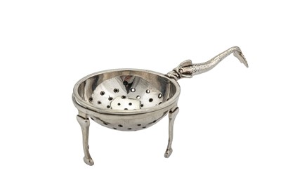 Lot 325 - A George V Scottish sterling silver Traprain Hoard tea strainer on stand, Edinburgh 1925 by Brook and Sons