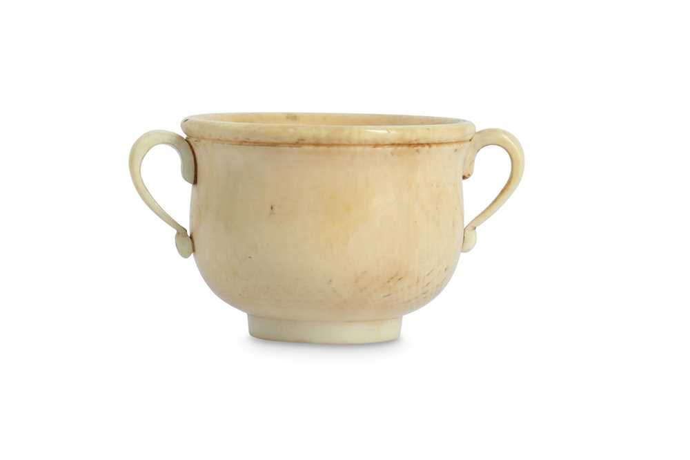 Lot 611 - λ A CHINESE IVORY MINIATURE DOUBLE HANDLED CUP.