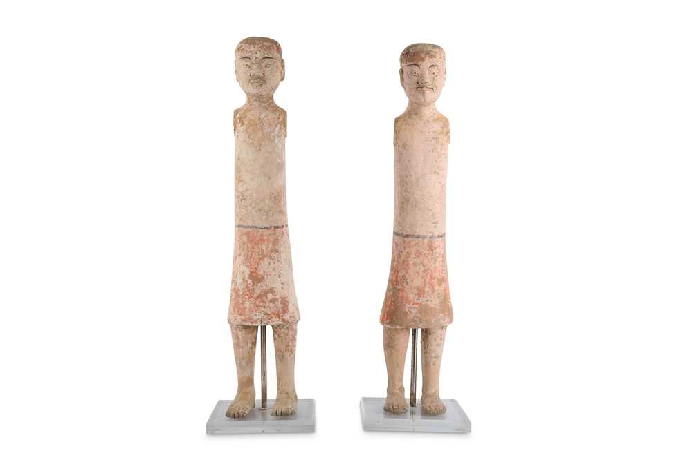 Lot 501 - A PAIR OF CHINESE POTTERY MALE FIGURES.