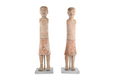Lot 312 - A PAIR OF CHINESE POTTERY MALE FIGURES.