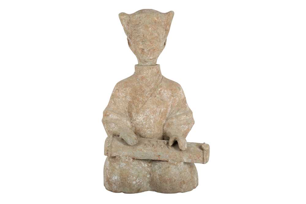 Lot 310 - A CHINESE POTTERY FIGURE OF A SEATED MUSICIAN.