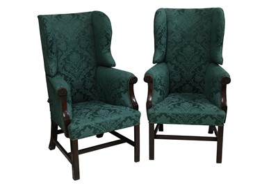 Lot 387 - A pair of early 19th century mahogany reclining wingback armchairs