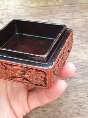 Lot 37 - A CHINESE CINNABAR LACQUER THREE-TIERED BOX AND COVER.
