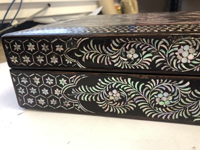 Lot 324 - A CHINESE MOTHER OF PEARL-INLAID LACQUER BOX AND COVER.