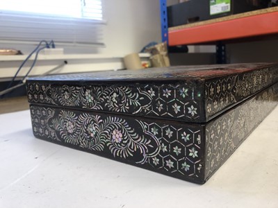 Lot 324 - A CHINESE MOTHER OF PEARL-INLAID LACQUER BOX AND COVER.