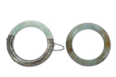 Lot 577 - TWO CHINESE HARDSTONE BANGLES.