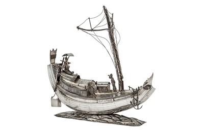 Lot 120 - A second half of the 20th century Burmese unmarked silver model of an Irrawaddy rice boat