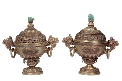 Lot 987 - A PAIR OF TIBETAN WHITE METAL INCENSE BURNERS AND COVERS.