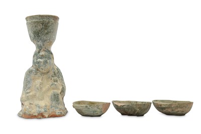 Lot 477 - A CHINESE GREEN-GLAZED POTTERY CANDLESTICK AND THREE 'EAR' CUPS.