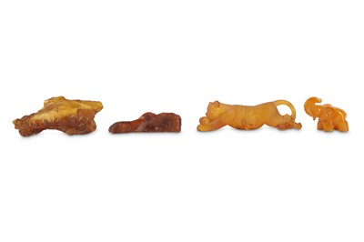 Lot 68 - FOUR CHINESE AMBER CARVINGS.
