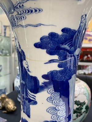 Lot 352 - A CHINESE BLUE AND WHITE 'IMMORTALS' TRUMPET VASE.