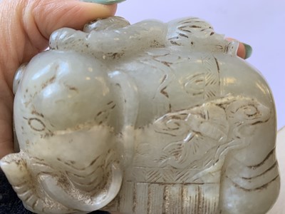 Lot 415 - A CHINESE PALE CELADON JADE CARVING OF A BOY AND AN ELEPHANT.