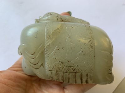 Lot 415 - A CHINESE PALE CELADON JADE CARVING OF A BOY AND AN ELEPHANT.